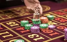 Cloudbet casino presented on mobile device in Pakistan with slots and live games